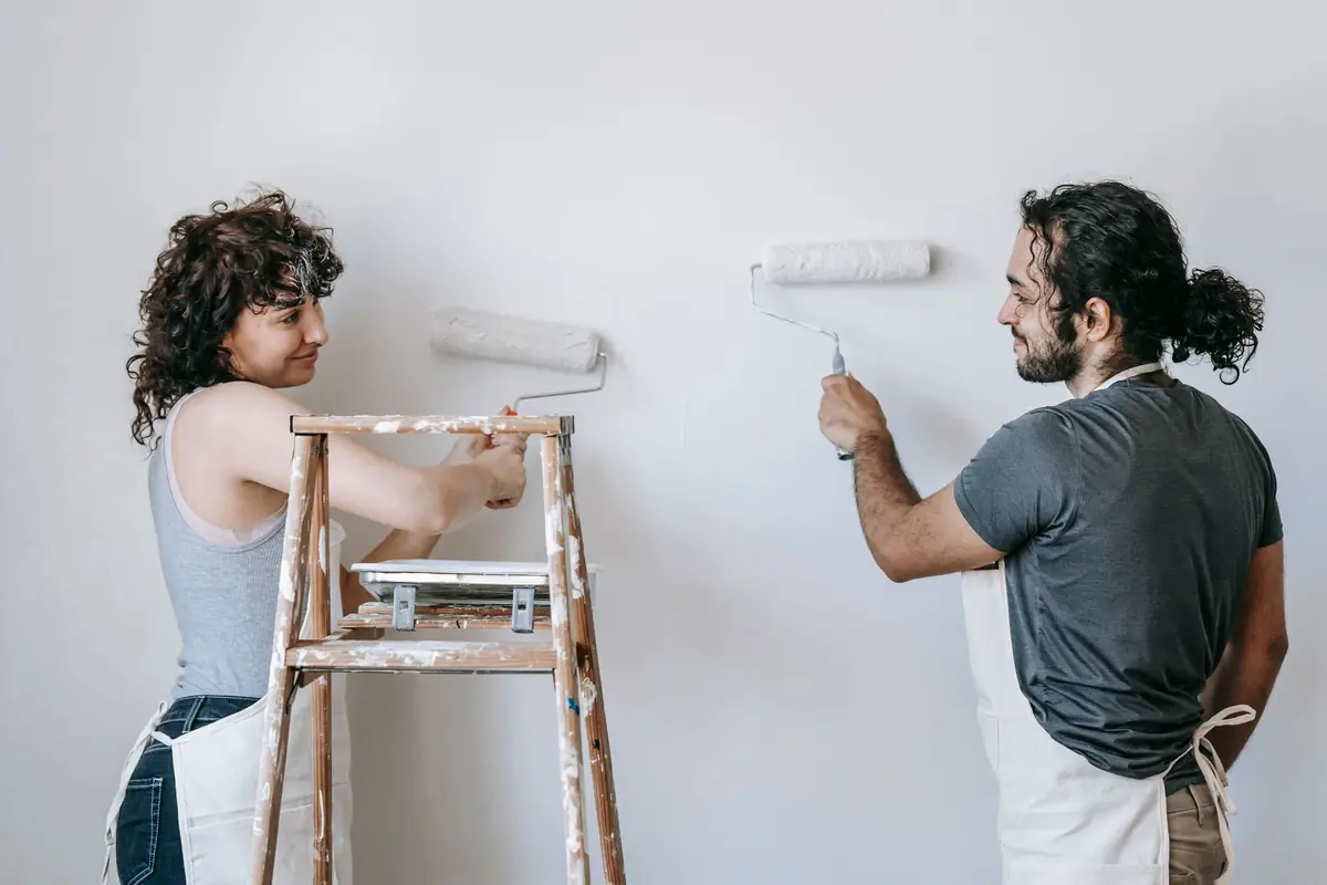 People painting a wall together — painting help in Stockton